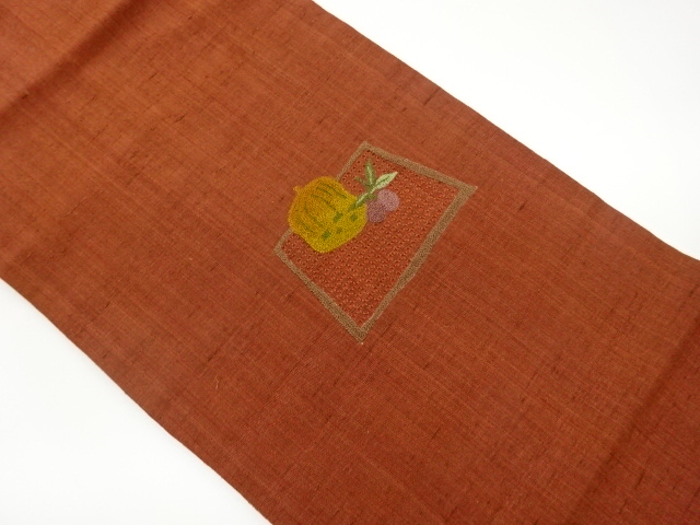 手織り紬汕頭相良刺繍変わり色紙に果実模様名古屋帯